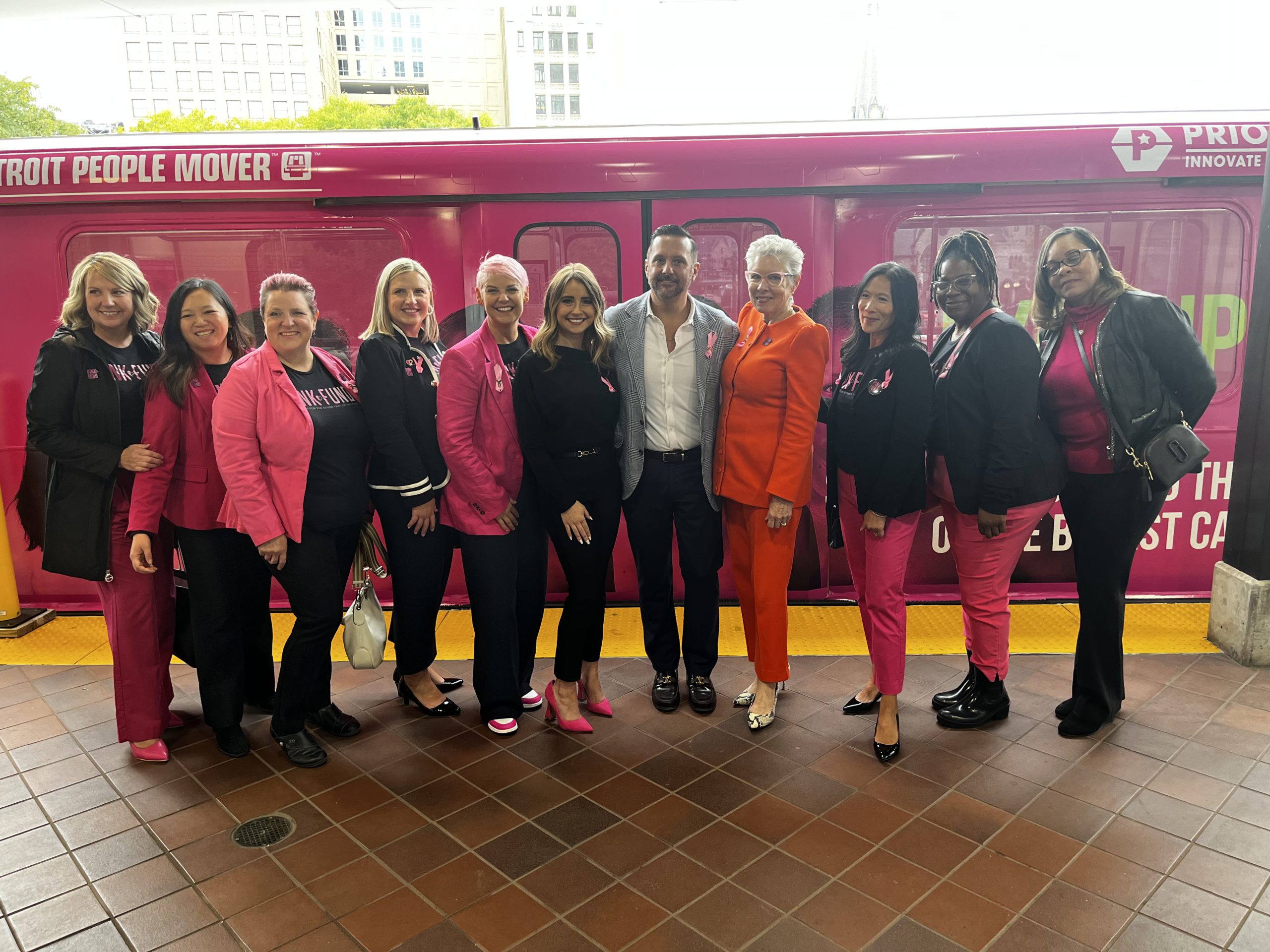Detroit People Mover wrapped in Pink with Pink Fund's Eyes Up Here Campaign